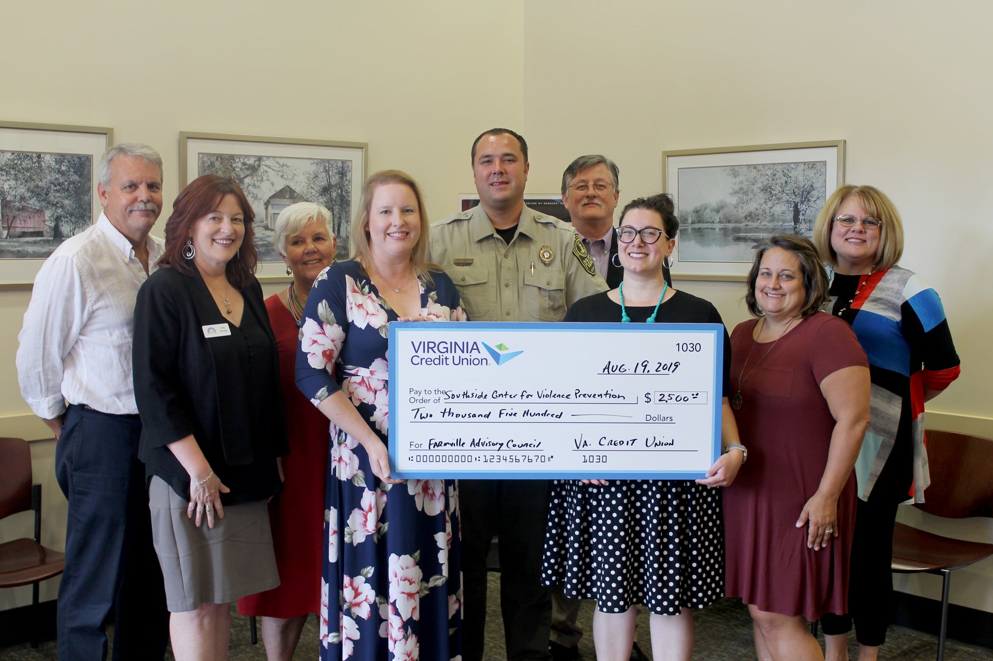 Members of the Farmville Advisory Council for Virginia Credit Union present a $2,500 check to Elizabeth Chassey of the Southside Center for Violence Prevention