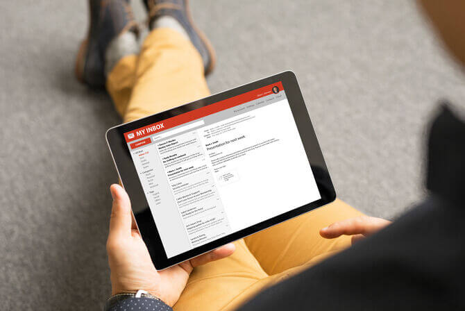 Man reading email on tablet