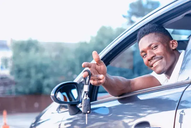 A man with the keys to his new car