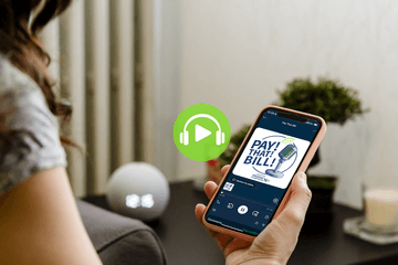 Woman looking at Pay That Bill podcast on mobile phone