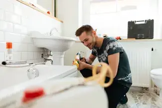 A man fixing his bathtub