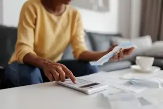 Woman using a calculator 