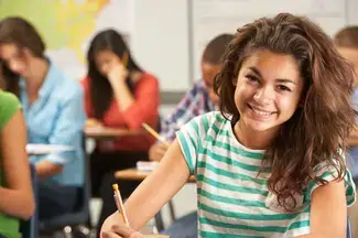 A young student in a classroom.