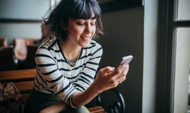 A woman on her smartphone.