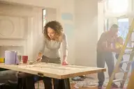 family working on house