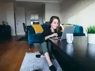 A woman on her laptop in living room