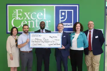 VACU presenting  contribution to the Goodwill's Excel Center in support of adult learners pursuing high school diplomas