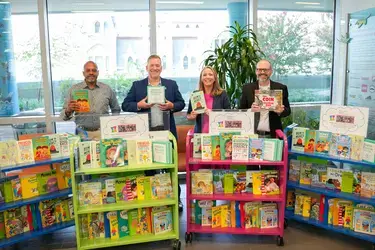 VACU financial education resources and book donations cart at ChoR