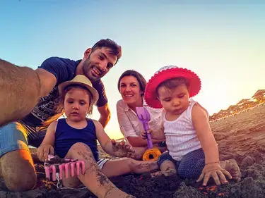 Family playing on the beach