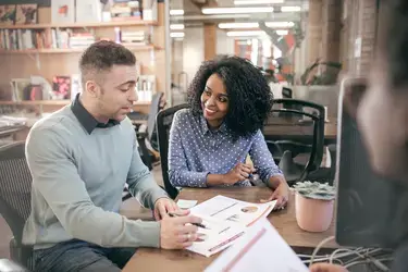 man and woman working in an office