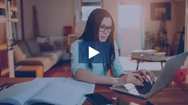 young girl typing on computer