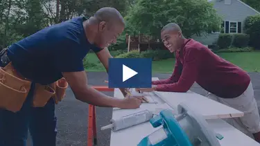 son and dad working on a project