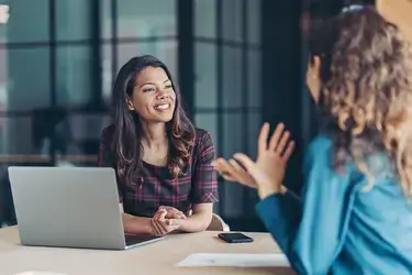 A woman negotiating with her employer for a raise