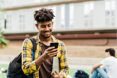 Young adult on phone checking online banking.