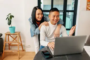 Couple looking at laptop