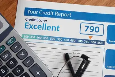 A calculator on top of a form that says "Your Credit Report."