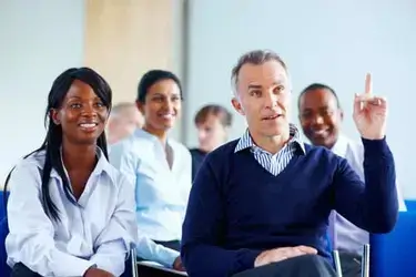 Group of people sitting in a class.