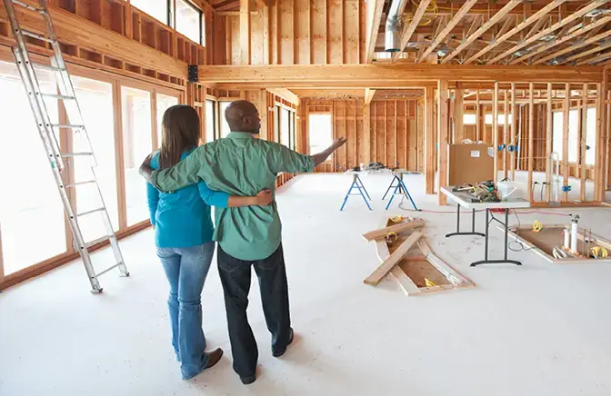 A couple in their new home under construction